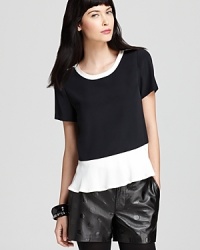 Black and white with a charming pop of a peplum, this MARC BY MARC JACOBS top is right on trend for fall with striking color block details.