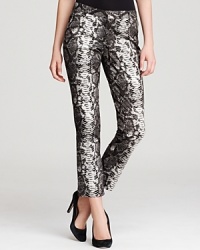 Unleash your exotic side with these snake-print MICHAEL Michael Kors pants. Finish the style with a razor-sharp blazer and spark some serious fashion envy.