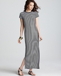 Cut a graphic silhouette in this MICHAEL Michael Kors maxi dress sharply styled with shoulder-to-shoe stripes. Punctuate the optic silhouette with acid-bright accents.