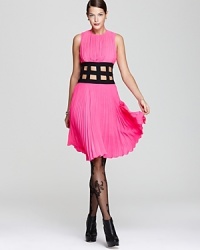 Pretty pink pleats meet a contrast cutout waist in a BCBGMAXAZRIA dress that's one cut above the rest.