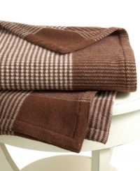 Beat the cold with this super-soft throw from Lauren Ralph Lauren. Features a houndstooth knit in cream and brown hues for a cozy addition anywhere in your home.