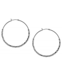 Twice more, with feeling. BCBGeneration's hoop earrings, crafted from silver-tone mixed metal, get stylish geometric accents for a textured feel that's sure to please.