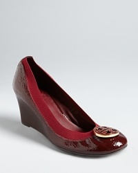 Your favorite Tory Burch logo flats stand tall placed on platform wedges. Give your look a lift.