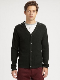 A classic waffle-knit cardigan made from impeccable virgin wool and featuring convenient patch pockets.V-neckLong sleevesElbow-patch detailsButton frontPatch pocketsVirgin woolDry cleanImported