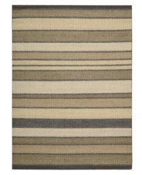 Variegated striping gives way to understated sophistication in the Horizon area rug from Calvin Klein. Generously thick wool fibers are hand tufted in India for remarkable strength and detailed design. (Clearance)