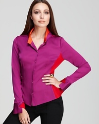 Go from color blocking to color shocking in this Elie Tahari blouse, finished with an ornately printed back for a statement approach to the classic shirt.