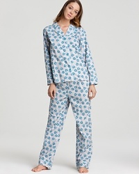 Go for a stylish bedtime look in this peacock feather printed pajama set from 40 Winks.