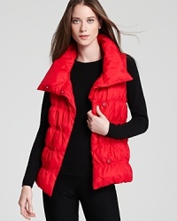 A statement collar and chic quilting infuse a down Eileen Fisher vest with sporty-chic edge. Slip the plush layer over everyday basics and transition seamlessly from city blocks to ski slopes.