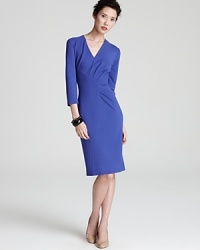 Asymmetrical seaming creates a sophisticated silhouette on this Escada jersey dress in a saturated statement hue.