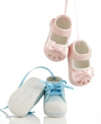 A perfect gift for new parents, baby shoe ornaments from Midwest are crafted of pale pink or blue porcelain with coordinating ribbon. Flip them over to fill out the date and child's name.