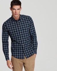 A striking check shirt from Theory in superior soft cotton is designed with a modern silhouette for maximum coolness.