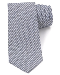 Demonstrate your sartorial wisdom with a classic tie featuring simple stripes from Armani Collezioni.