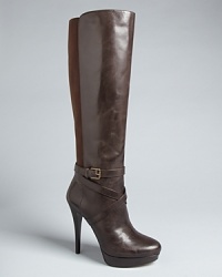 Hautely appealing, these KORS Michael Kors platform boots are polished off with buckle details.