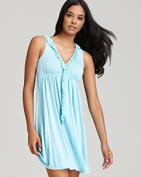 Exude elegance in a flowy chemise with ruffle trim along a V-neckline and down center front.