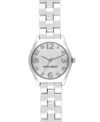 A clean and classic design with a charming twist, by Nine West. Watch crafted of silver tone mixed metal bracelet and round case. Silver tone dial features applied numerals, hour and minute hands, sweeping second hand and logo at six o'clock. Quartz movement. Limited lifetime warranty.