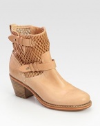 Perforated leather moto design with adjustable wrap-around buckles and a chunky stacked heel. Stacked heel, 2½ (65mm)Leather upperPull-on styleLeather lining and soleRubber solePadded insoleImportedOUR FIT MODEL RECOMMENDS ordering true size. 