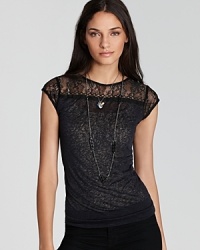 A delicate lace Free People is a stand alone statement maker as well as a layer-perfect look beneath a cropped blazer or leather moto jacket this season.