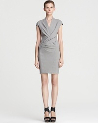 Sophisticated, modern and undeniable chic, this Helmut Lang dress is a modern interpretation of the classic sheath and a must-have for the fashion-forward career woman. Punctuate the minimalist silhouette with chunky wedges and head directly to the corner office.