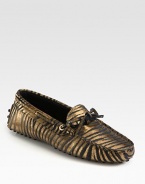 Moccasin-inspired silhouette of metallic leather takes on an exotic zebra print for a fashionable look. Zebra-print metallic leather upperLeather liningRubber solePadded insoleMade in Italy