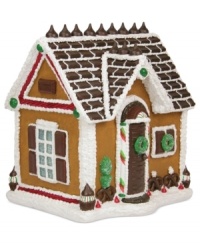 Retreat to the holiday home of Hershey's. A faux gingerbread house covered with a roof of candy bars and Kisses and decorated with sugar wreaths and peppermint swirls ensures a sweet holiday, season after season.