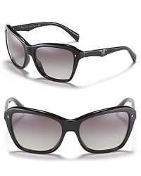 Go for beach chic in Prada's oversized cat eye sunglasses with metal studs and logo detail at temples.