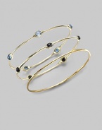 Five faceted blue topaz stones are sprinkled along a slender bangle of 18k gold. Blue topaz 18k yellow gold Diameter, about 2¾ Imported Please note: Bracelets sold separately.