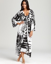 An abstract mix of tiger stripes and leopard spots covers this Natori robe, featuring ruffle trim at the waist.