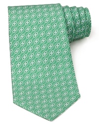 Signature Gancini logos are banded by stripes for an alluring pattern on this handsome Salvatore Ferragamo silk tie.