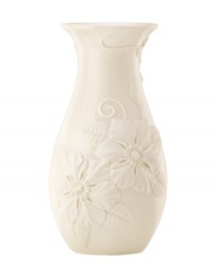 Teeming with fresh blooms, the Floral Fields vase from Lenox exudes a serene, understated elegance. A simple silhouette in creamy ivory porcelain balances elaborate sculpted detail.