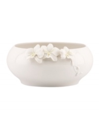 Sculpted orchids pop with a tinge of yellow against this glossy white Flora bowl A quiet beauty in graceful Lenox porcelain.