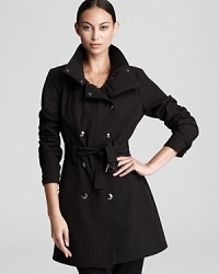 Classically tailored and forever chic, this Calvin Klein trench coat lends impeccable polish to your outerwear repertoire.