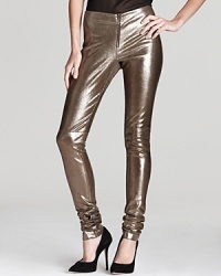 Glamorously punctuate your party-perfect wardrobe with these gilded Alice + Olivia leggings, fashioned in supple metallic leather.