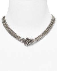 A chic silver-plated necklace with three braided rows and a chunky knot to cinch the look.