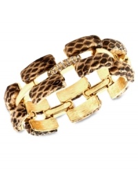 Sink your teeth into this chic bracelet from Ann Klein. The slip-on design features rectangular links covered in snake skin leather. Crafted in gold tone mixed metal. Approximate length: 8 inches.