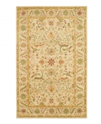 Enjoy a thousand years of rug-making tradition -- set against a soft ivory ground -- with this striking area rug from Safavieh. Tufted in India from pure wool, this rug emerges from the annals of antiquity to bring spectacular style and time-honored quality to your home. (Clearance)