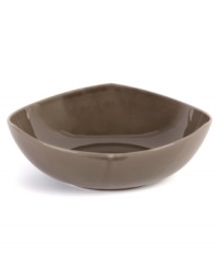 Inspired by an iconic Nambe design, this sculptural serving bowl features three gentle points in sleek, sturdy stoneware and a sophisticated espresso hue. An essential part of the Tri-Corner dinnerware collection.