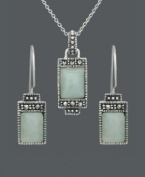 Express peace and tranquility in the form of pale, green hues. Cabochon jade stones (7 mm x 9 mm and 5 mm x 7 mm) make a serene statement when framed by the subtle glitter of marcasite. Genevieve & Grace set crafted in sterling silver. Approximate necklace length: 18 inches. Approximate pendant drop: 1 inch. Approximate earring drop: 1 inch.