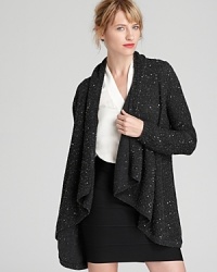 A dash of sequins enlivens the classic C by Bloomingdale's cashmere cardigan. Slip it on and step into the spotlight.