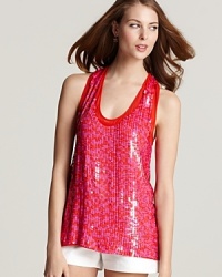 Luscious pink and red sequins decorate the front of this Theory tank creating a decadent look for 24 hours of style. Pair with crisp white shorts or pants and let the hues pop of the top.