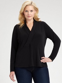 Understated and graceful, this sleek knit top has unlimited wardrobing possibilities.V necklineCrossover surplice bodiceEmpire seamed waistLong sleevesPolyester/elastaneDry cleanImported