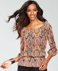 An exotic print lends a boho-chic feel to INC's peplum-hem peasant top.