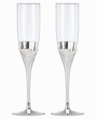 Toast your sweetie or favorite newlyweds with True Love. Interlocking hearts adorn elegant, silver-plated champagne flutes, a fitting way to commemorate every anniversary.