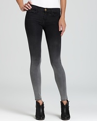 Update your fall denim wardrobe with Current/Elliott cropped skinny jeans in an edgy ombré wash.