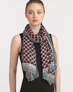 A woven modal scarf is embellished with a colorful print with contrasting border.ModalAbout 65 X 46Dry cleanImported