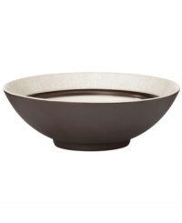 A universal favorite, the Lucia all-purpose bowl combines a modern shape and classic style. Earthy stoneware with a crackle effect and lustrous metallic glaze brings easy sophistication to casual settings. By Niels Refsgaad for Dansk.