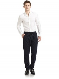 THE LOOKWide elastic waistband with drawstring tiesButton flyDual seam pocketsElastic cuffsBack flap pocketTHE FITRise, about 10Inseam, about 29½THE MATERIAL62% cotton/38% woolCARE & ORIGINDry cleanMade in Italy