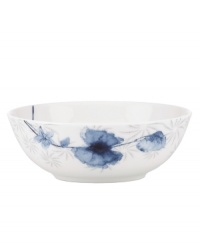 A fresh take on floral patterns, the Watercolors Indigo Blue bowl features painterly blossoms in shades of blue against a lively geometric design. White bone china in an ultra-modern shape provides a sleek foundation for a look that's irresistibly fun. (Clearance)