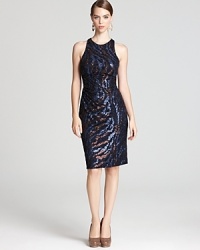 Swirling sequins lend sparkle to a sporty racerback silhouette from David Meister.