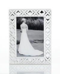 Mirroring the intricate folds of origami, this gleaming silver-plated picture frame makes art of any memory. From Martha Stewart Collection.