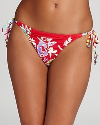 Strut your stuff in this Nanette Lepore bold red bikini bottom featuring a tropical hula print. Pair it with the matching top or mix it up and say aloha without speaking a word.